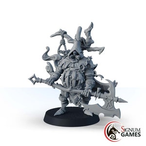 May include: A gray plastic miniature figurine of a hooded figure holding a large axe. The figure is wearing a long robe and has a large, ornate hat. The figure is standing on a round base.
