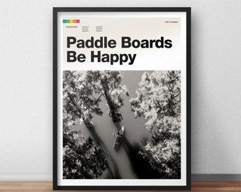 May include: Black and white photo of a person paddling a canoe down a river surrounded by trees. The text "Paddle Boards Be Happy" is at the top of the image.