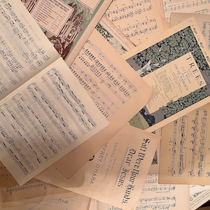 May include: A collection of vintage sheet music featuring musical scores and song titles like "Trees" and "Soft Were Your Hands, Dear Jesus".