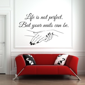 May include: Black and white wall decal with the text "Life is not perfect. But your nails can be." and a stylized image of two hands with manicured nails.