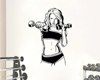 May include: Black and white silhouette of a woman lifting weights. The woman is wearing a sports bra and shorts. The image is a wall decal.