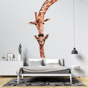 May include: A watercolor illustration of a mother giraffe and her baby giraffe peeking around a corner. The giraffes are brown with light brown spots. The mother giraffe is looking at the camera with a gentle expression. The baby giraffe is looking at the camera with a curious expression.