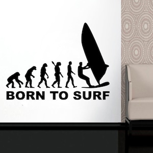 May include: Black and white silhouette of the evolution of man, ending with a person windsurfing. The text "BORN TO SURF" is below the image.