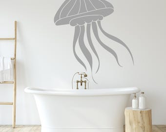 May include: A gray jellyfish wall decal with a white outline, above a white bathtub in a bathroom setting.