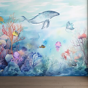 May include: A watercolor painting of an underwater scene with a whale, a stingray, a turtle, an octopus, jellyfish, and coral. The painting is in shades of blue, pink, and green.