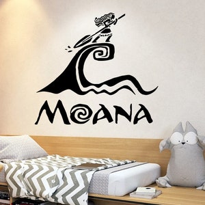 May include: Black wall decal with the word "MOANA" and a silhouette illustration of a figure on a wave. Ideal for a child's bedroom or themed space. The design is a silhouette.