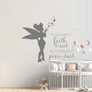 May include: A gray silhouette of Tinkerbell blowing pixie dust with the text "All you need is faith trust and a little bit of pixie dust" on a white wall.