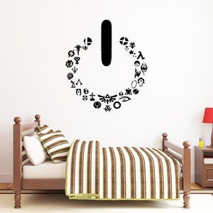 May include: A black and white power button graphic with a circle of video game logos around it. The logos include Nintendo, Super Mario, Zelda, and more.