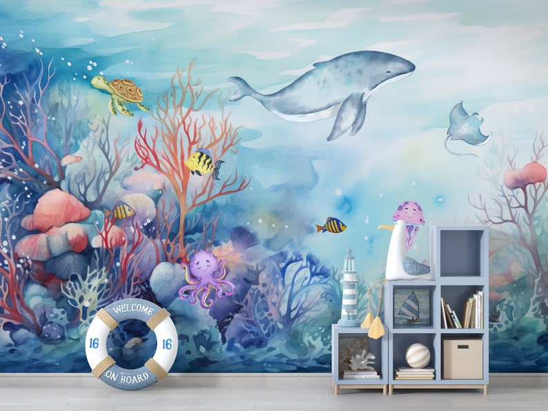 May include: A watercolor mural depicting an underwater scene with a whale, coral, fish, an octopus, a turtle, a jellyfish, and a life preserver that says "Welcome on Board".