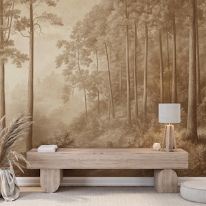 May include: A light brown wooden bench with rounded legs sits in front of a wall mural depicting a sepia-toned forest scene. A table lamp with a white shade sits on the right side of the bench.