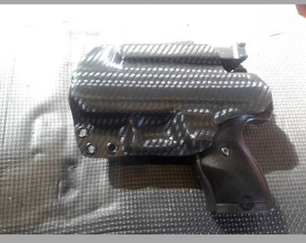 Funda Taurus GX2 personalizada de Kydex con portacargador Piggyback. Fibra de carbono negra y 11 colores adicionales a elegir. Garantía de por vida.