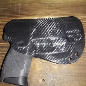 Taurus G2C Custom Kydex Holster with Viridian Laser Black Carbon Fiber plus 11 more colors to choose from. Lifetime Warranty.  Made in U.S.A