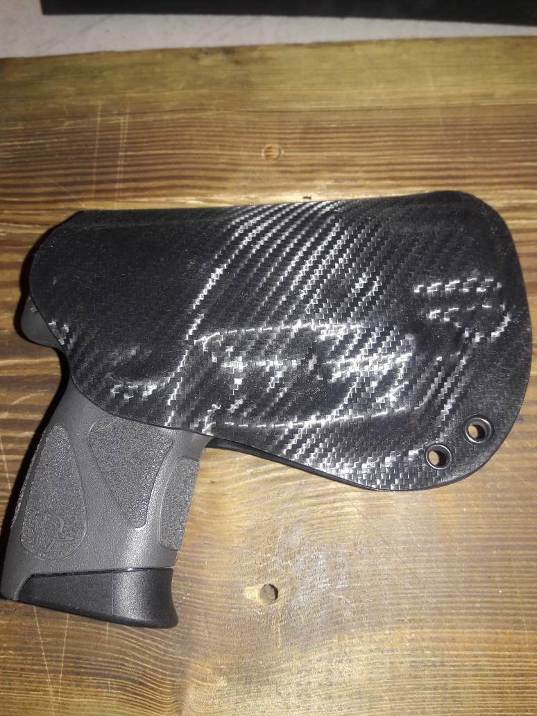 Taurus G2S Custom Kydex Holster with Viridian Laser Black Carbon Fiber plus 11 more colors to choose from. Lifetime Warranty.  Made in U.S.A