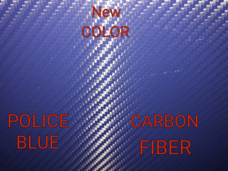 May include: A close-up of a blue carbon fiber material. The text "New Color" is written in red above the material. The text "Police Blue" is written in red below the material on the left. The text "Carbon Fiber" is written in red below the material on the right.