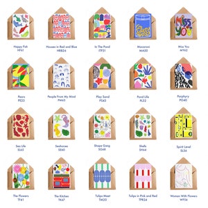 May include: A collection of greeting cards with various colorful designs, each in a brown envelope. Designs include illustrations of hearts, fish, houses, and abstract shapes. Text on some cards reads "Miss You" and other titles.