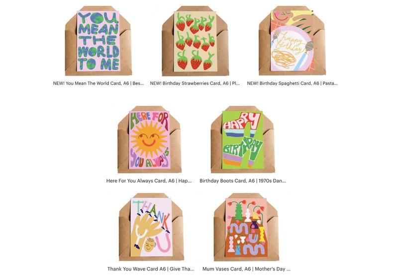 May include: A collection of colorful greeting cards in brown envelopes. The cards feature various designs, including strawberries, spaghetti, a sun, and the phrases "You Mean The World To Me," "Happy Birthday," and "Thank You."