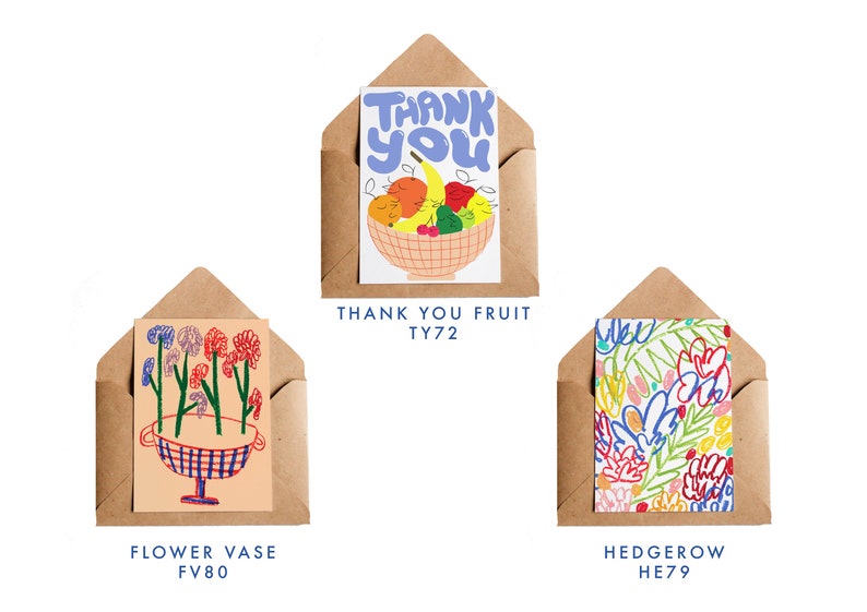 May include: Three greeting cards in brown envelopes. The top card says "THANK YOU" above a fruit bowl illustration. The middle card shows a flower vase design. The bottom card features a colorful floral pattern. Each card has a unique design.