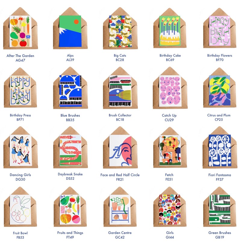 May include: A collection of greeting cards in brown envelopes. Each card features a unique, colorful illustration. Designs include fruits, flowers, abstract art, and birthday themes. The cards are labeled with titles and codes like "After The Garden AG47."