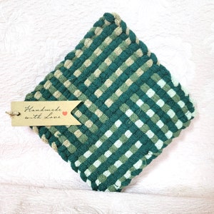 May include: Green and beige woven pot holder with a brown tag that says "Handmade with Love" and a red heart.