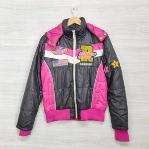 May include: Black and pink puffer jacket with a white stripe and a yellow patch that says "Yellow Ranking". The jacket has a zipper closure and a hood.