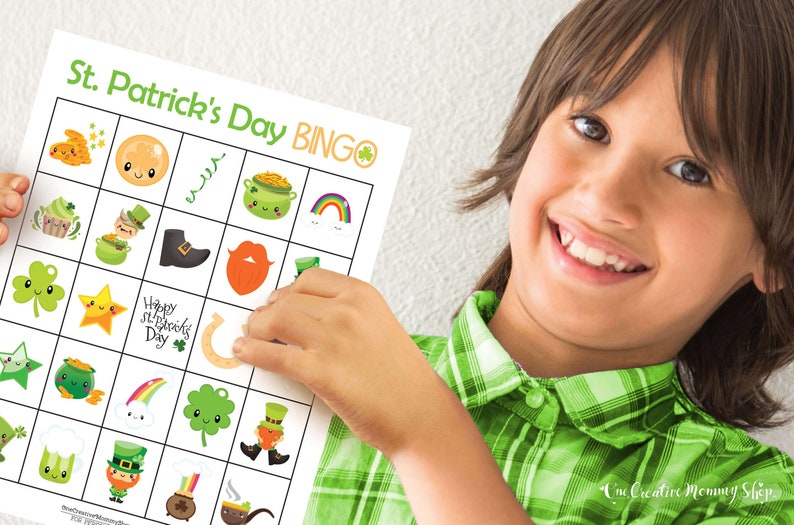 Boy proudly holding up a St. Patricks Day bingo card