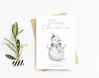 May include: A Christmas card featuring a watercolour illustration of a snowman wearing a green hat and scarf. The card reads "Merry Christmas" and "With love from the Richardson's".