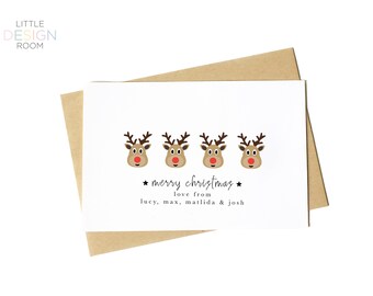 May include: A white Christmas card with four cartoon reindeer faces and the text "merry christmas" and "love from lucy, max, matlida & josh"
