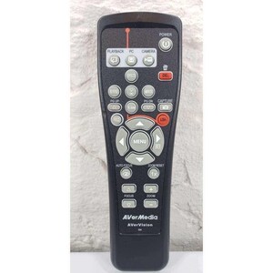 May include: A black AVerMedia remote control with multiple buttons for playback, PC, and camera functions. The remote has a power button, a menu button, and zoom controls. The brand name and model are visible at the bottom.