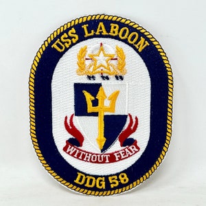 May include: A navy blue and white embroidered patch with a gold rope border. The patch features a shield with a trident, a crown, and the text "USS LABOON DDG 58 WITHOUT FEAR".