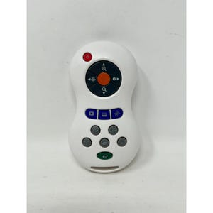 May include: A white remote control with several buttons and a circular navigation pad. The buttons are various colors, including red, blue, and green. The remote is designed with a rounded shape.