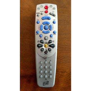 May include: A silver Dish Network remote control with blue and red buttons. The remote has a variety of buttons for power, volume, and channel control. The Dish Network logo is at the bottom.