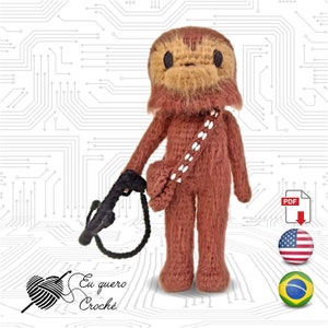 May include: Crocheted Chewbacca amigurumi doll with a black blaster rifle. The doll is brown with a white bandolier and has a furry face. The image includes the text "Eu quero Crochê" and a yarn ball with a needle.