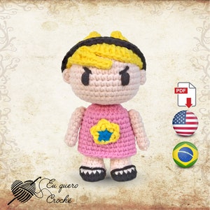 May include: Crocheted amigurumi doll with yellow hair, pink dress, and a blue star. The doll has a grumpy expression and is wearing black shoes.