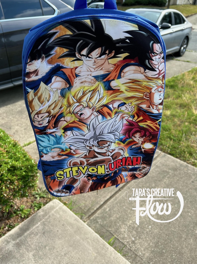 May include: A blue backpack featuring a vibrant graphic print of various Dragon Ball Z characters in different forms, including Super Saiyan variations. The name STEVON URIAH is printed in bold yellow and red letters across the lower section of the bag.