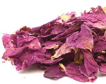 May include: A pile of dried rose petals in shades of pink and yellow against a white background. The petals are textured and appear to be of varying sizes, suggesting a natural product. Ideal for potpourri or crafting.