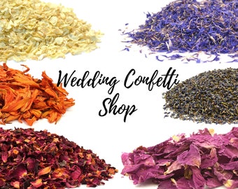 May include: Assortment of dried flower petals for wedding confetti.  The petals are in six colors: white, blue, lavender, orange, red, and pink.  Wedding Confetti Shop.