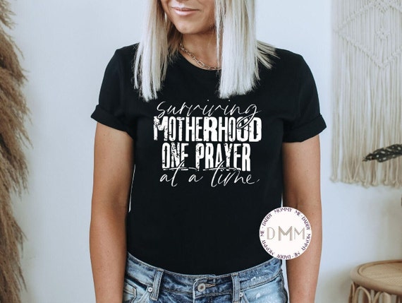 Surviving Motherhood One Prayer At A Time Shirt - Praying Mom Shirt - Christian Moms Shirt - Unisex Graphic Tee - Mom Gift - This Mama Prays