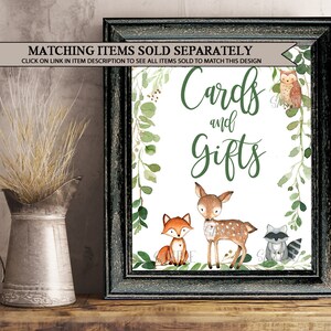 May include: A printable sign with a white background and green foliage border. The sign says "Cards and Gifts" with a cute fox, deer, and raccoon illustration.