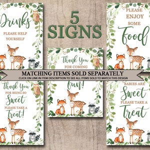 May include: Five printable signs with a woodland theme. The signs feature a deer, fox, and raccoon with green foliage. The text on the signs reads: "Drinks, Please Help Yourself", "Thank You For Coming", "Fun!", "Babies Are Sweet, Please Take A Treat", and "Please Enjoy Some Food".