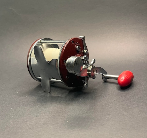 Penn Peer 109 In Red Side Plates and Red Handle Fishing Reel