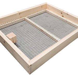 May include: A wooden frame with a wire mesh insert. The frame is made of natural wood and has a rectangular shape. The wire mesh is made of metal and is attached to the frame with staples.