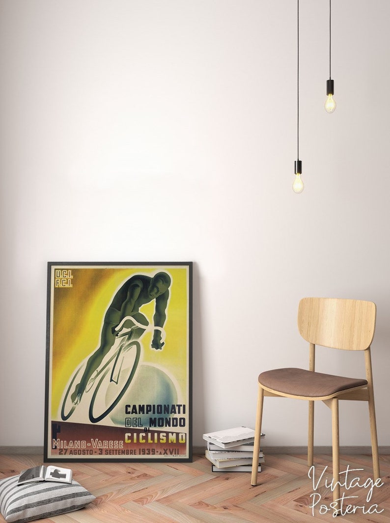 May include: Vintage poster advertising the 1939 World Cycling Championships in Milan-Varese, Italy. The poster features a cyclist in a yellow and green jersey riding a bicycle on a yellow background. The text on the poster reads "Campionati del Mondo di Ciclismo" and "Milano-Varese 27 Agosto-3 Settembre 1939 - XVII."