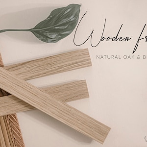 May include: Wooden frames made from natural oak and beech wood. The frames are arranged in a criss-cross pattern on a light brown surface.