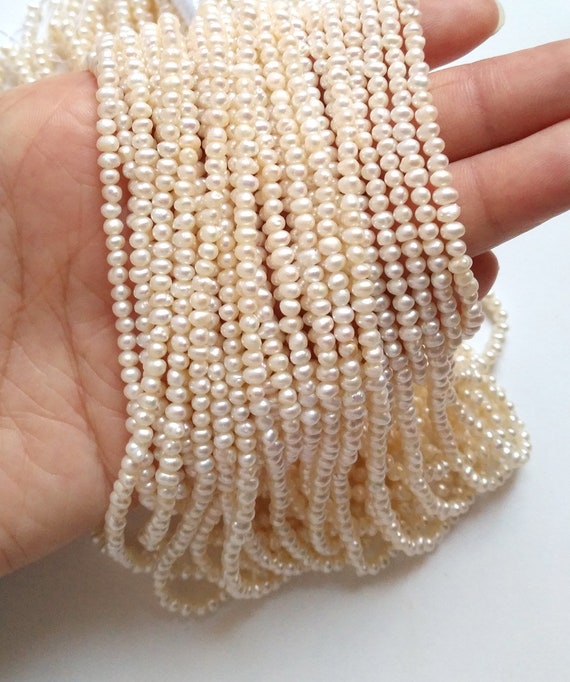 Wholesale Natural Cultured Freshwater White Pearl Round Loos Beads 14.5" Strand Wholesale Natural Cultured Freshwater White Pearl Round Loos Beads 14.5" Strand
