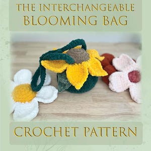 May include: A crochet pattern for "The Interchangeable Blooming Bag" is displayed. The image features a sunflower-shaped bag with yellow petals and a green handle, along with two crochet flower embellishments in white and pink. The text "CROCHET PATTERN" is also visible.