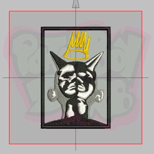 May include: Black and white embroidered patch with a crown above a face with horns. The crown is gold and the face is in a black frame.
