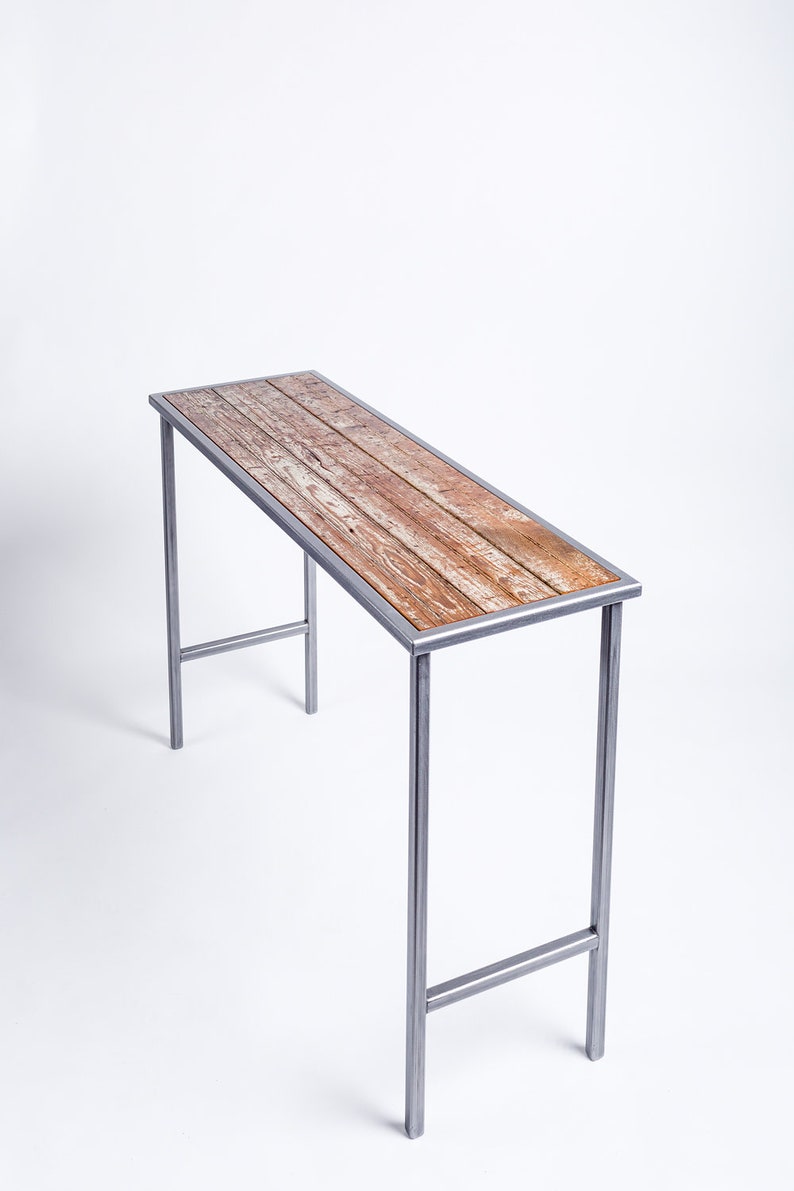 Handmade console table featuring reclaimed wood from a loading dock door dating back to the 1860s-1880s