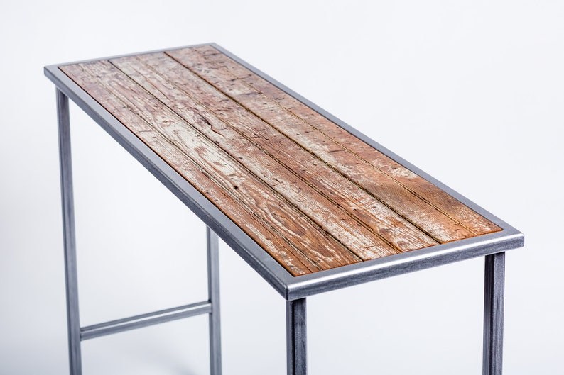 Handmade console table featuring reclaimed wood from a loading dock door dating back to the 1860s-1880s