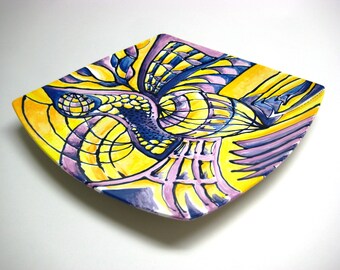 Hand painted ceramic plate in yellows and blues