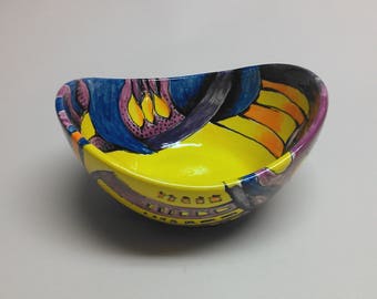 Hand painted ceramic "swoop" bowl with yellows, oranges and blues